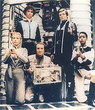 The final Seven, including the computers Orac and Slave.